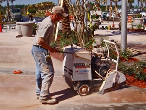 Motor propelled concrete saw.