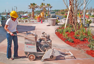 Diamond blades on concrete saw produce clean cuts to provide the grid-line accent. All lines are marked with chalk lines prior to cutting.