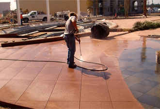 All decorative concrete is pressure washed prior to the application of sealer. This removes construction dust and debris and opens pours in the concrete to bind the sealer to the surface.
