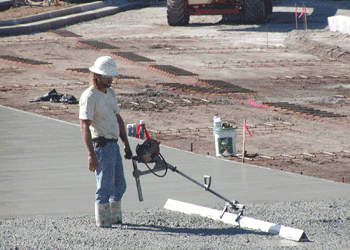 A vibrating float prepares a slab for trowelling or brooming.