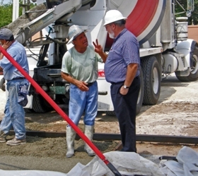 Concrete Division Vice President, Gerald Mims discusses scheduling and mix design adjustments with Ready-mix personnel during a large pervious concrete pour.