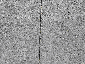 Saw cut joint from pervious concrete installed by Charger Enterprises over three years prior