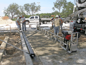 Installation crew interact with precision to produce our high quality pervious pavements